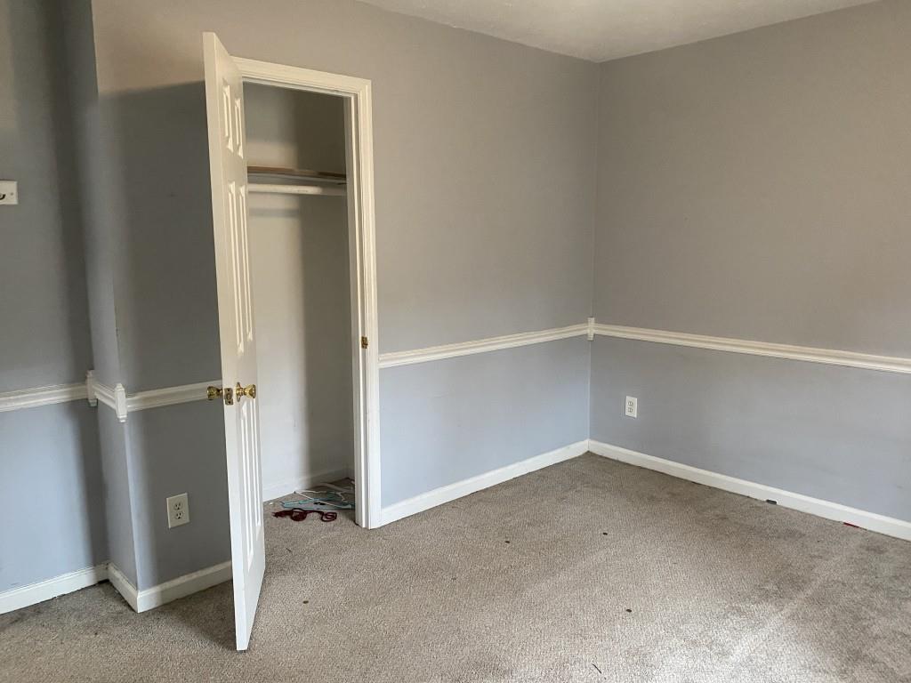 4749 Shallow Ridge Road Northeast Kennesaw, GA 30144 - Photo 22 of 28 an empty room with closet