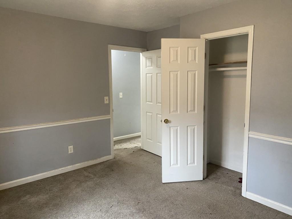 4749 Shallow Ridge Road Northeast Kennesaw, GA 30144 - Photo 23 of 28 an empty room with a door