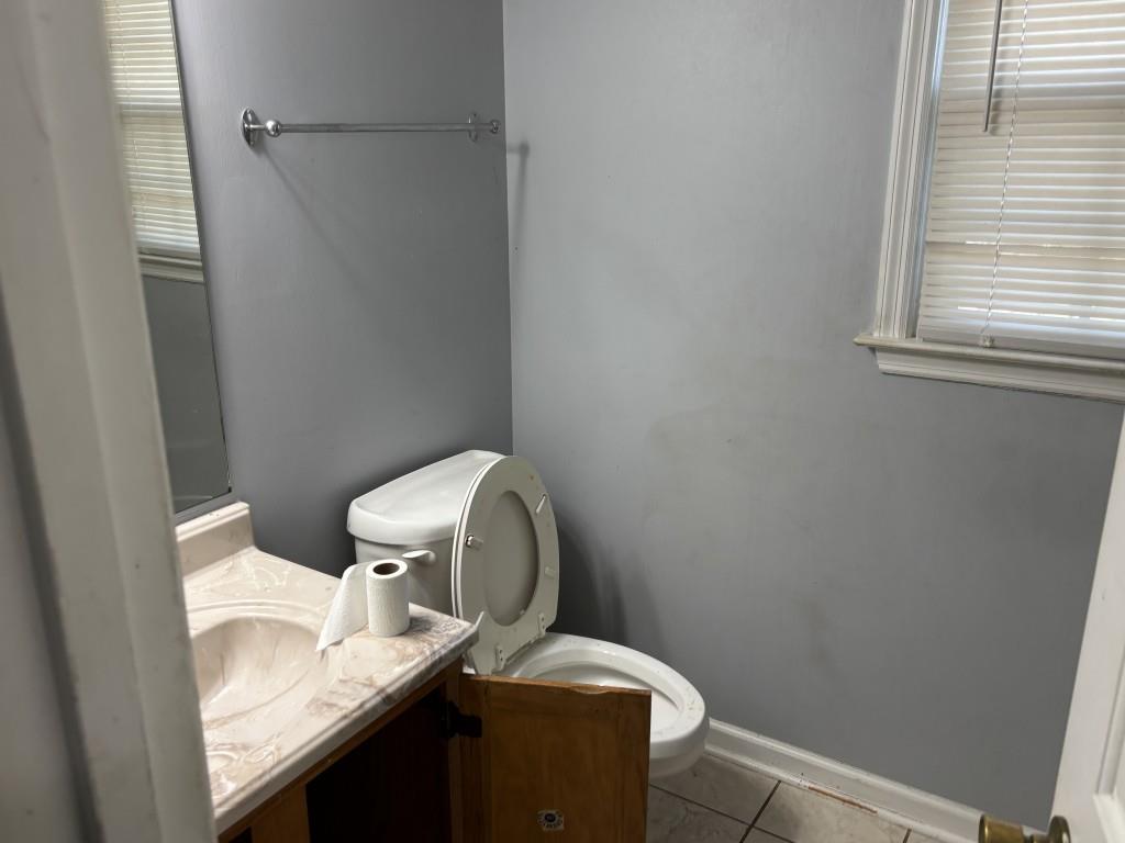 4749 Shallow Ridge Road Northeast Kennesaw, GA 30144 - Photo 24 of 28 a bathroom with a sink and toilet