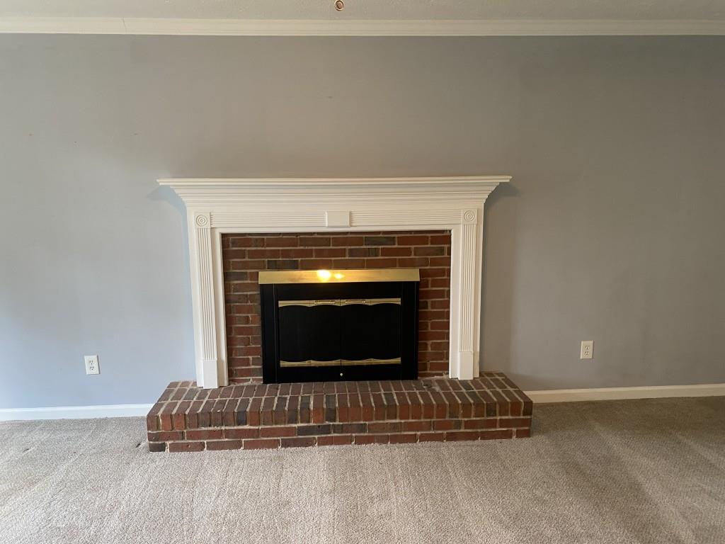 4749 Shallow Ridge Road Northeast Kennesaw, GA 30144 - Photo 5 of 28 a living room with a fireplace