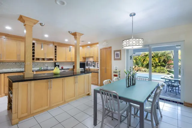 a living room with furniture gym equipment and a large window