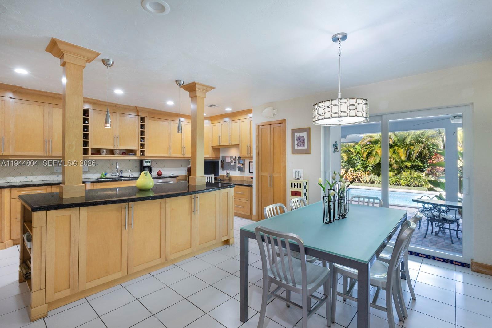 10281 Southwest 125th Street Miami, FL 33176 - Photo 12 of 45 a view of a dining table chairs and chandelier