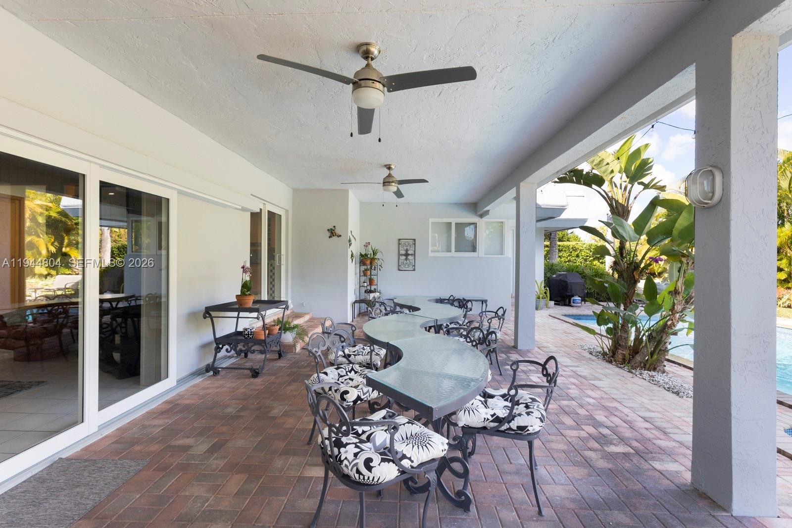 10281 Southwest 125th Street Miami, FL 33176 - Photo 21 of 45 a view of a dining room with furniture window and wooden floor