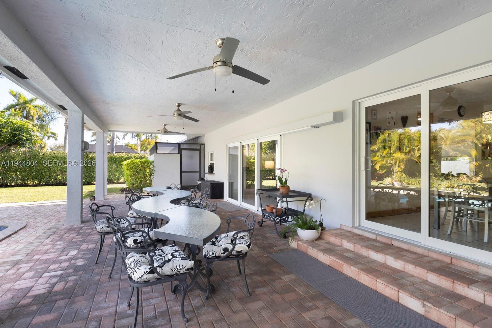 10281 Southwest 125th Street Miami, FL 33176 - Photo 22 of 45 a living room with furniture and a large window