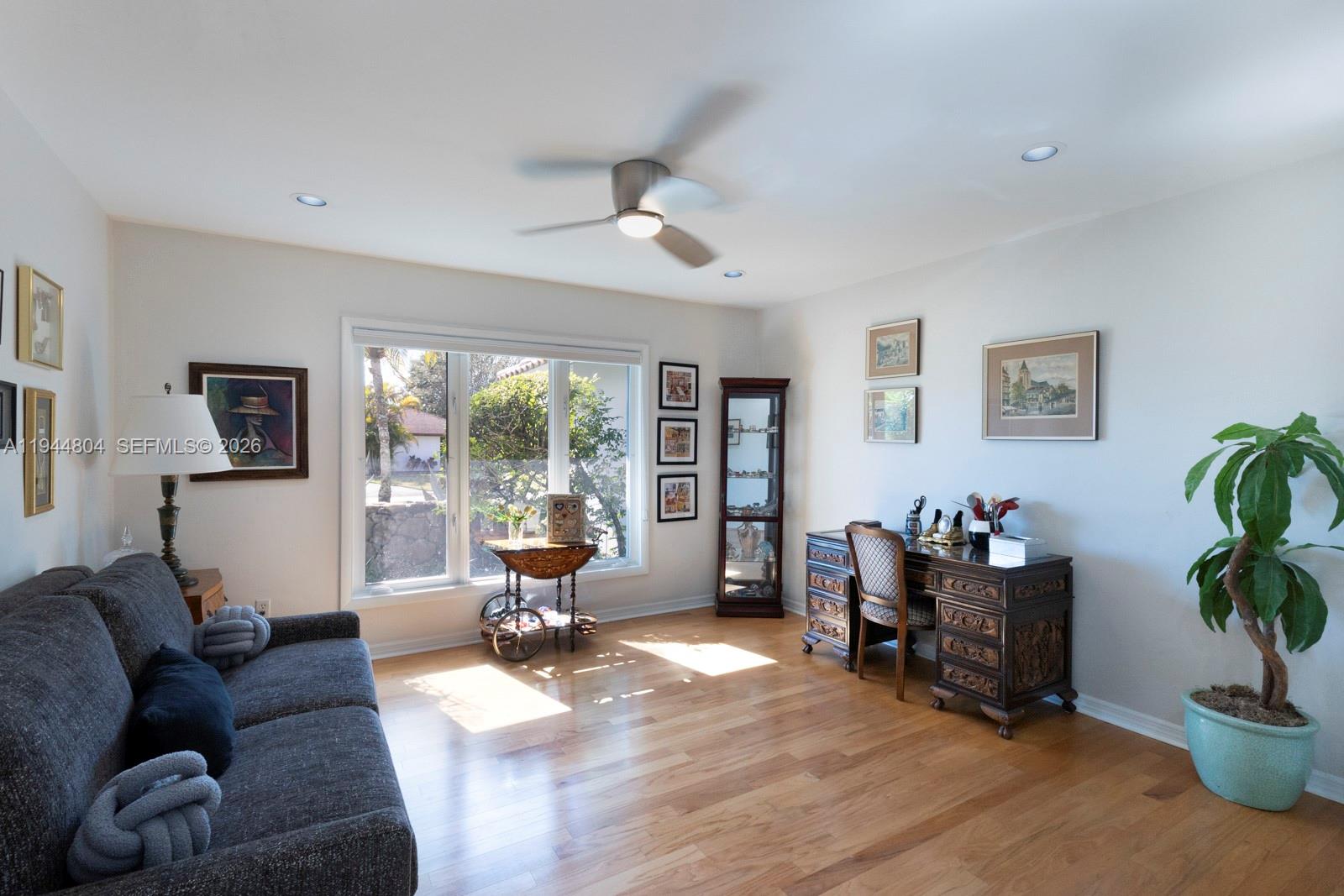 10281 Southwest 125th Street Miami, FL 33176 - Photo 28 of 45 a living room with furniture gym equipment and a large window