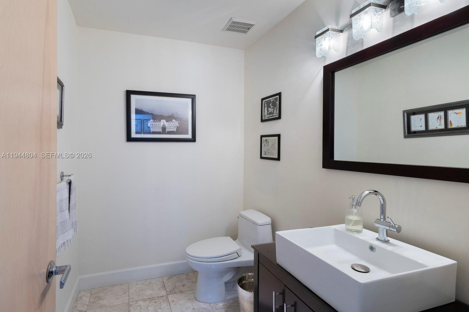 10281 Southwest 125th Street Miami, FL 33176 - Photo 29 of 45 a bathroom with a sink mirror and toilet