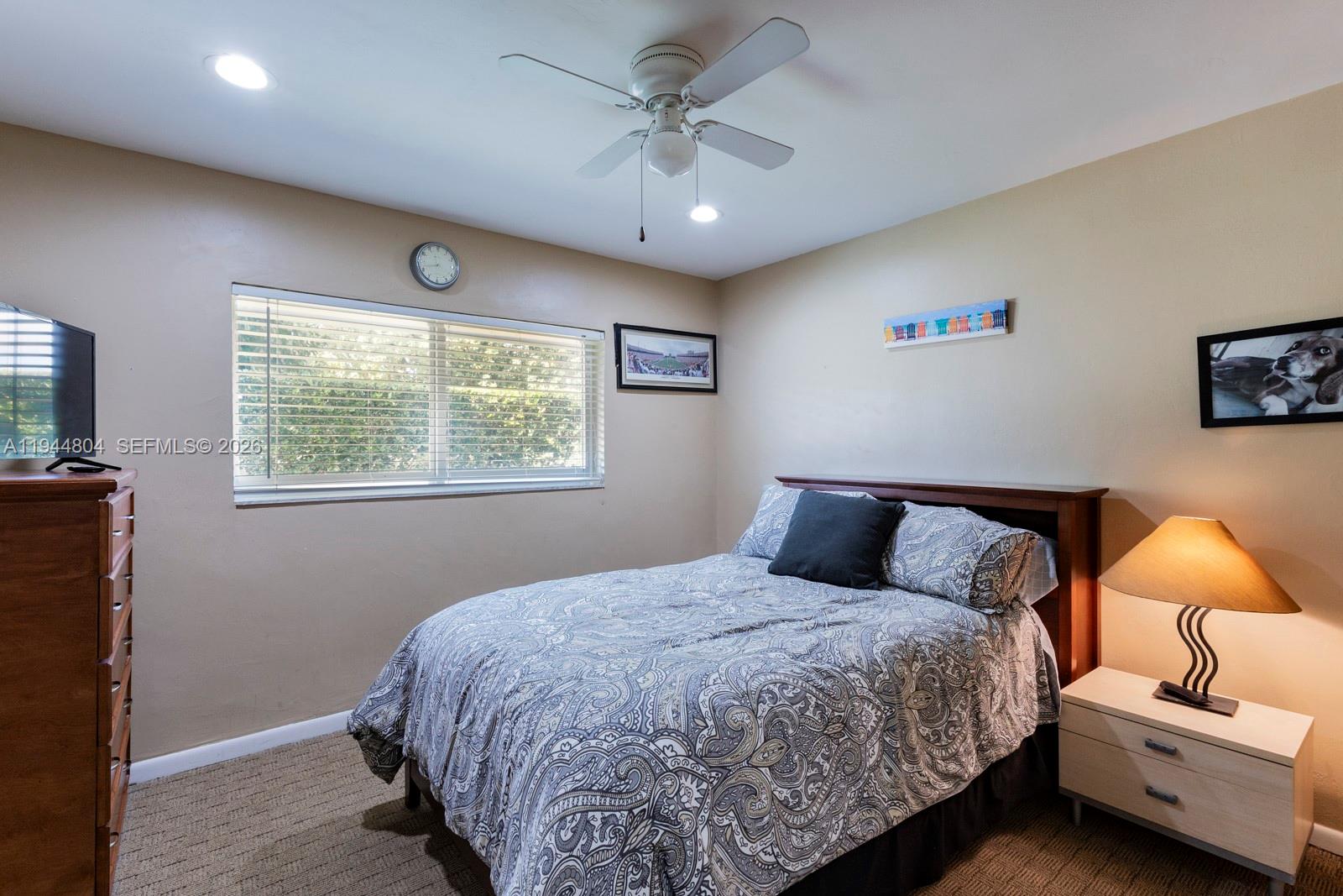 10281 Southwest 125th Street Miami, FL 33176 - Photo 31 of 45 a bedroom with a bed and a couch