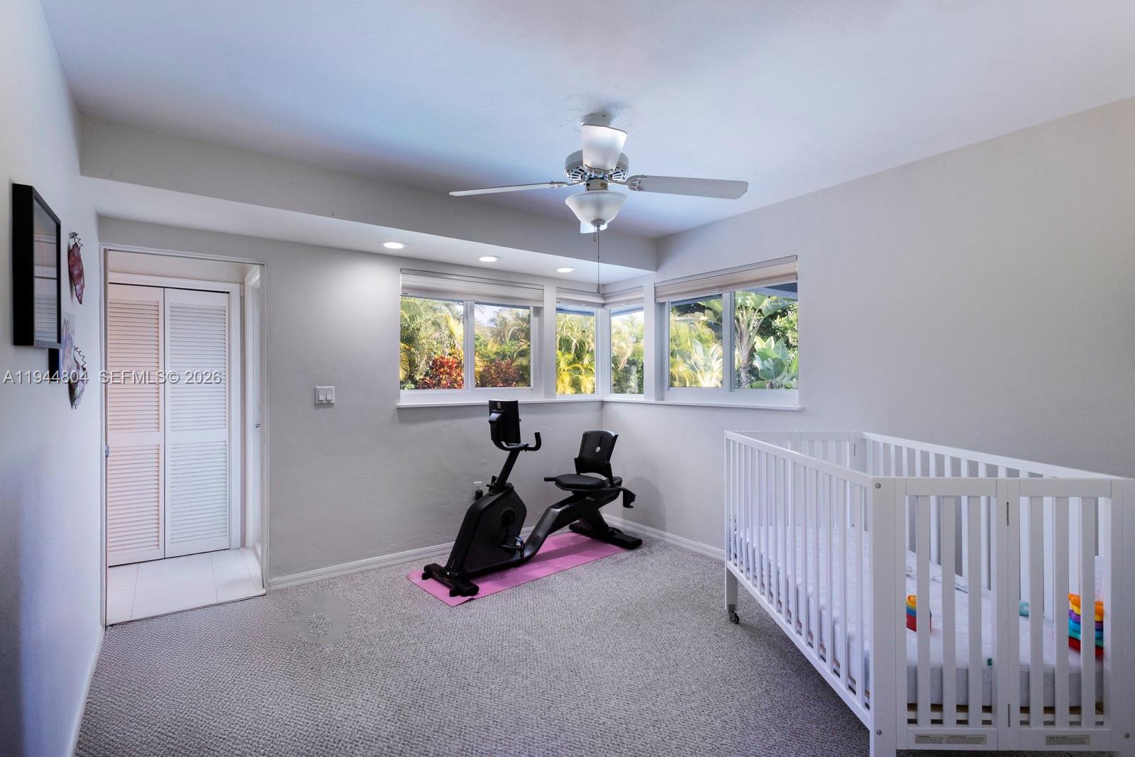 10281 Southwest 125th Street Miami, FL 33176 - Photo 33 of 45 a room with chandelier fan and windows