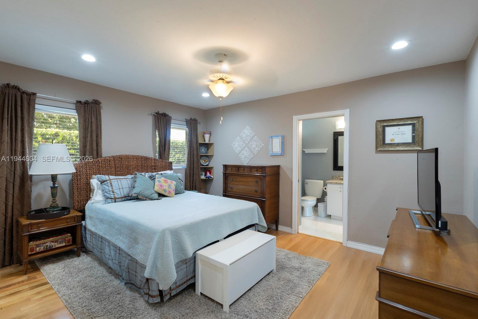10281 Southwest 125th Street Miami, FL 33176 - Photo 34 of 45 a bedroom with a bed and wooden floor