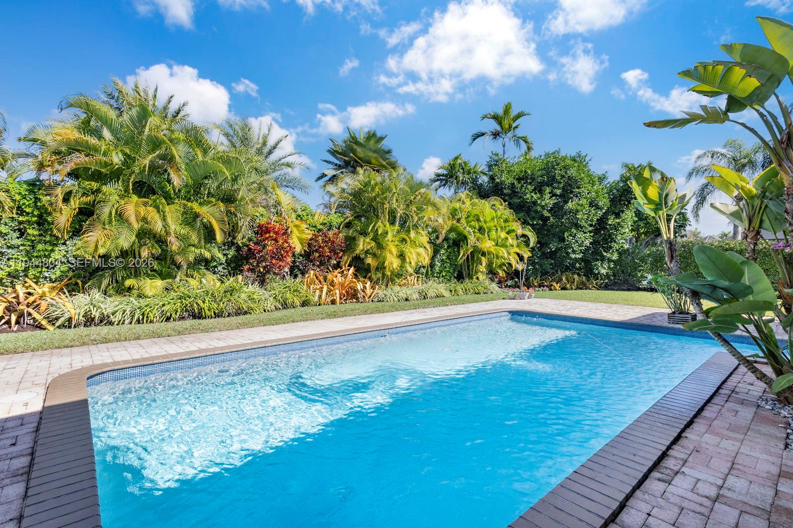 10281 Southwest 125th Street Miami, FL 33176 - Photo 36 of 45 a view of a swimming pool with an outdoor space