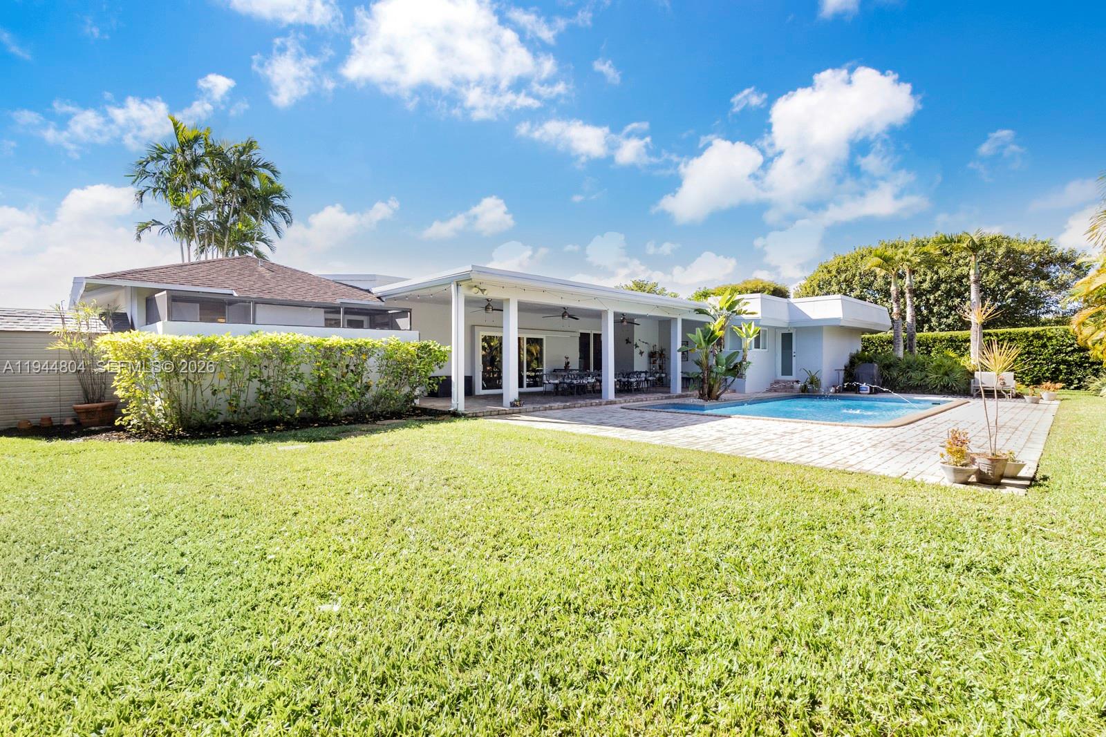 10281 Southwest 125th Street Miami, FL 33176 - Photo 37 of 45 a swimming pool with outdoor seating and yard
