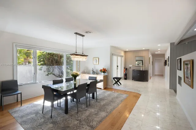 a view of kitchen with stainless steel appliances granite countertop sink and cabinets