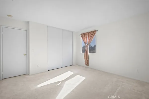 a view of empty room with stairs