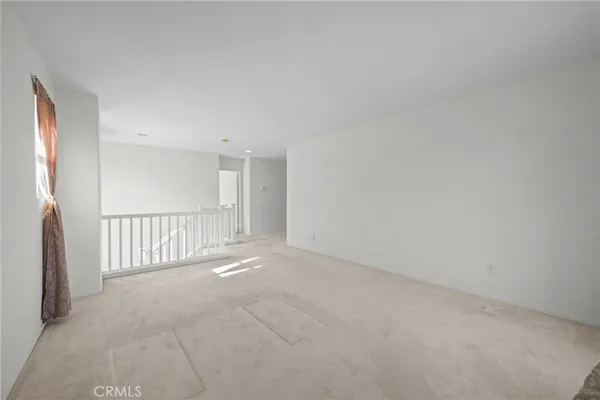 a view of empty room with fireplace