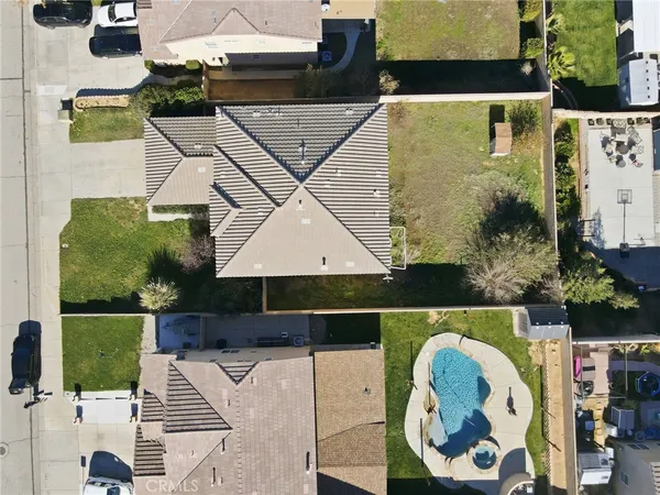 an aerial view of a house with a swimming pool
