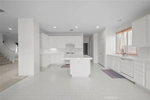 a bathroom with a sink a mirror and shower