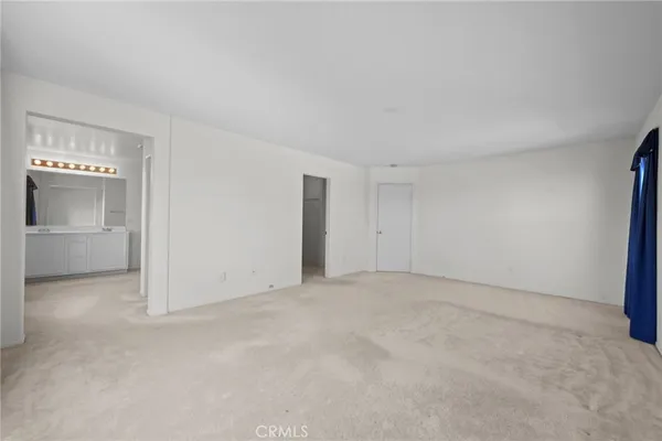 an empty room with a bathroom