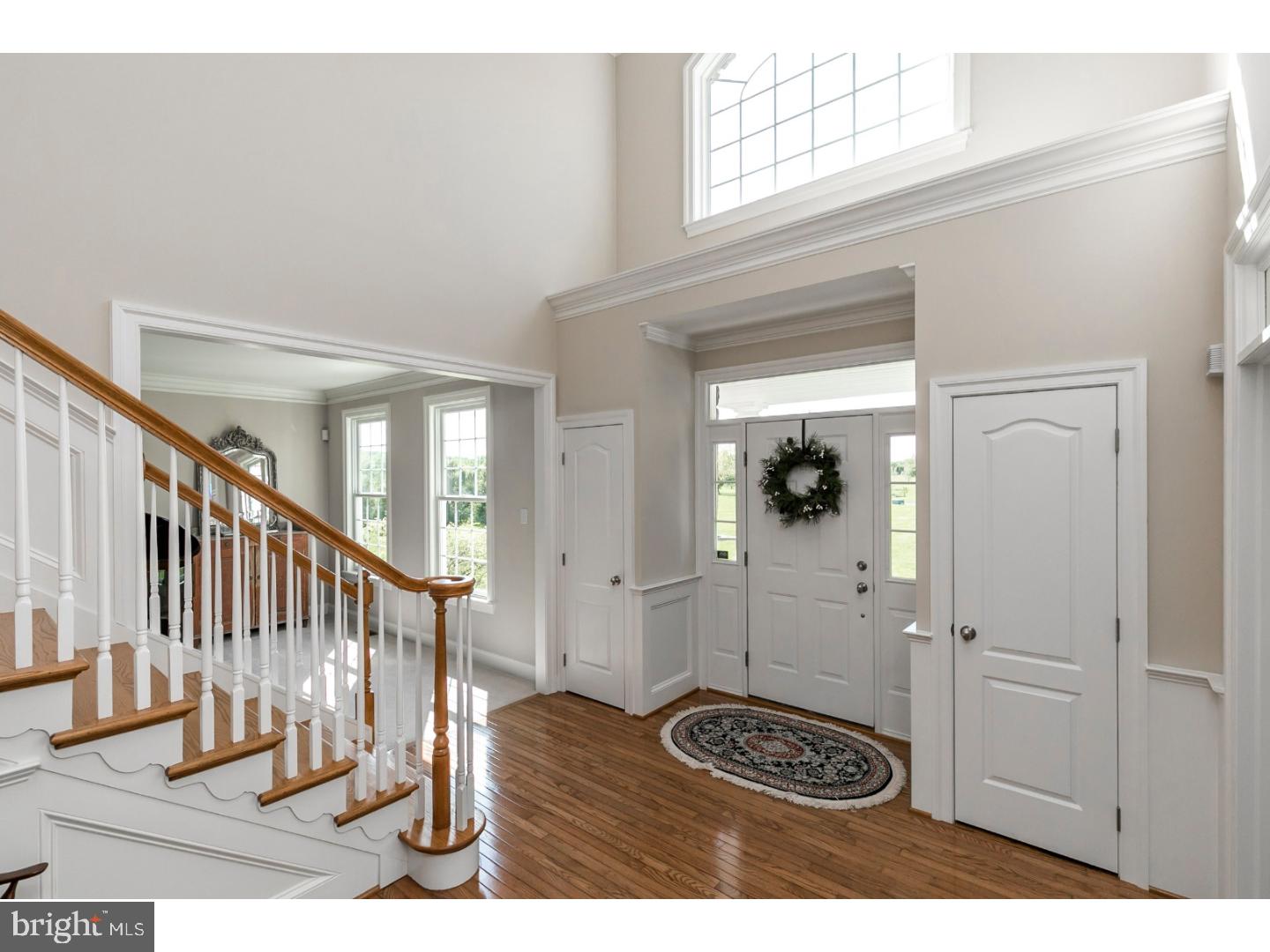 80 Paddock Circle Spring City, PA 19475 - Photo 3 of 25 a view of a hallway with wooden floor and chair
