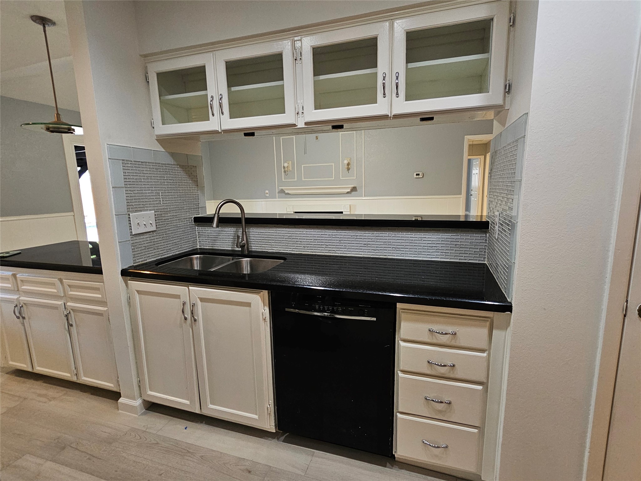 2502 Knoll Street Houston, TX 77080 - Photo 10 of 38 a kitchen with granite countertop a sink and a stove