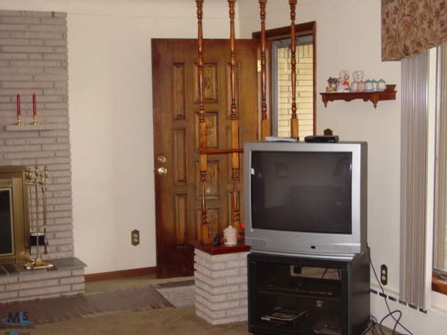 62 West Lapeer Road Peck, MI 48466 - Photo 16 of 25 This is a view of the front door area in the living room.