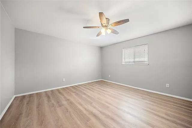 a view of a big room with wooden floor and closet