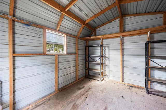 a view of a room with wooden walls