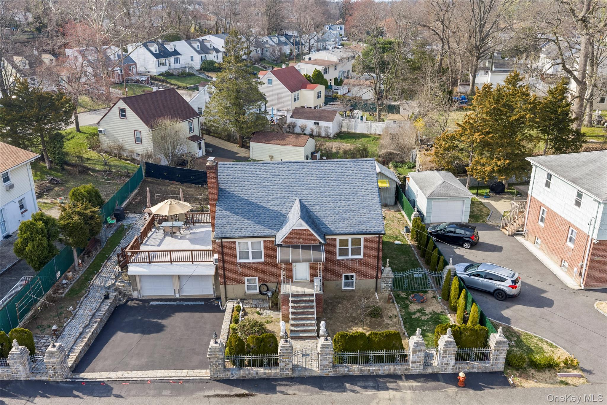 an aerial view of residential houses with yard