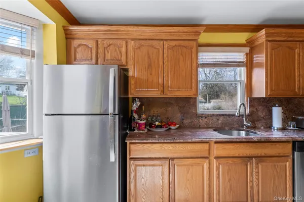 a white refrigerator freezer sitting in a kitchen