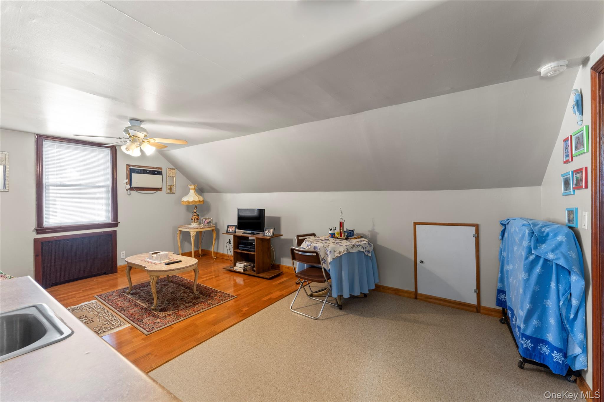 18 Butler Place Yonkers, NY 10710 - Photo 21 of 46 a living room with furniture a window and gym equipment