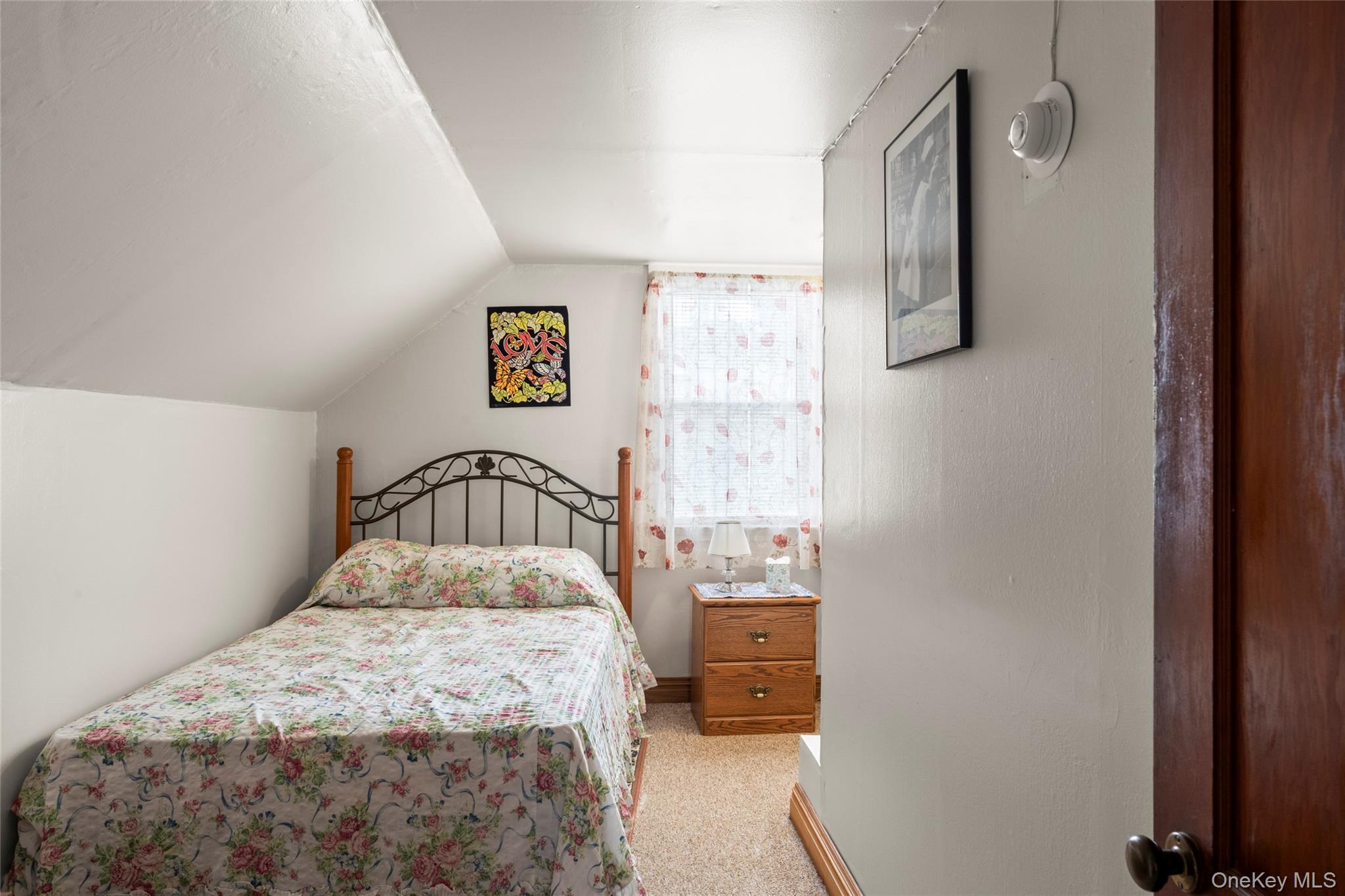 18 Butler Place Yonkers, NY 10710 - Photo 23 of 46 a bedroom with a bed and a window