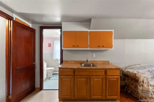 a bathroom with a sink a mirror and a shower