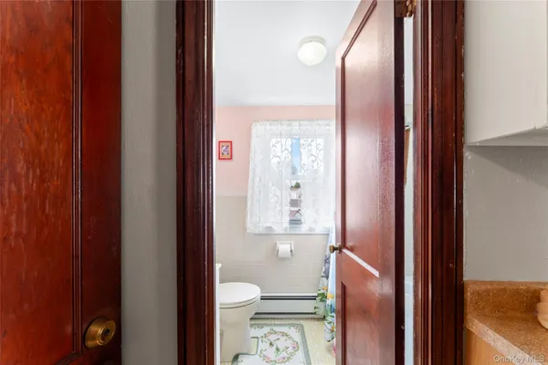 a bathroom with a toilet and a sink