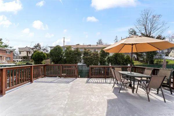 a terrace with outdoor seating and city view