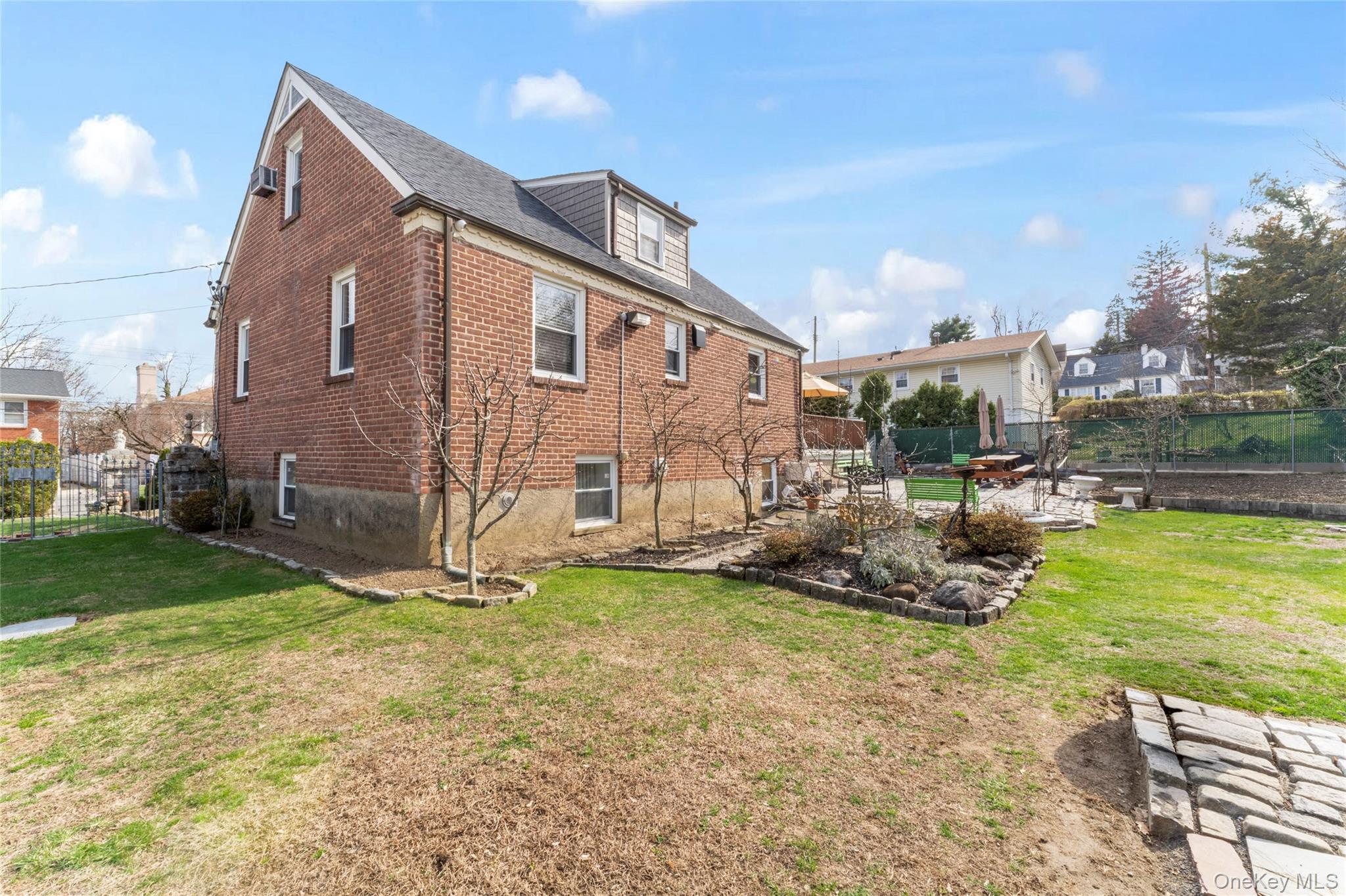 18 Butler Place Yonkers, NY 10710 - Photo 43 of 46 a backyard of a house with yard and outdoor seating