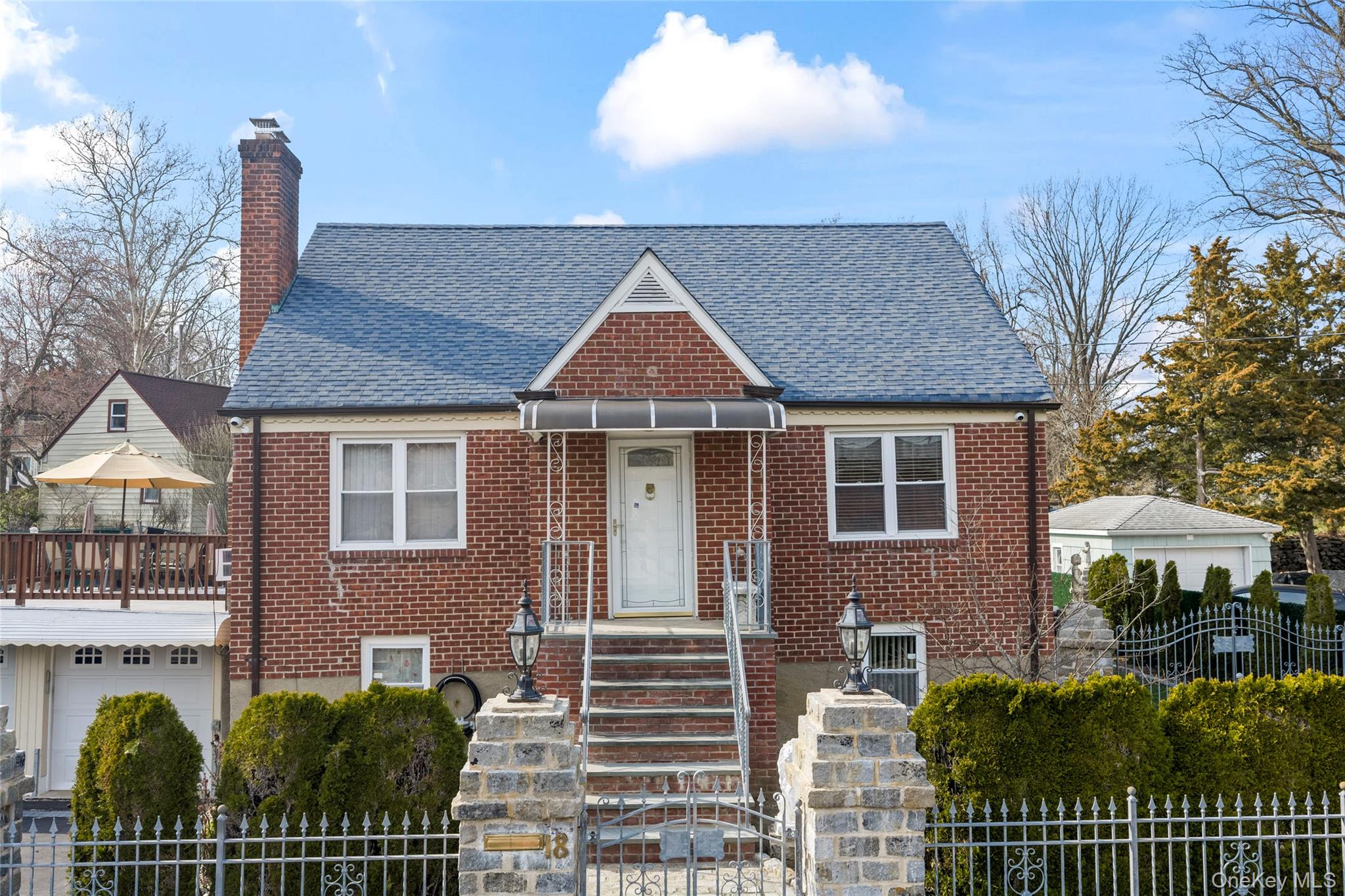 18 Butler Place Yonkers, NY 10710 - Photo 5 of 46 a front view of a house with a garden