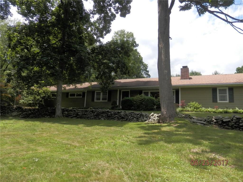 48 Mountain Road Wilton, CT 06897 - Photo 1 of 1 a front view of house with yard space and seating area