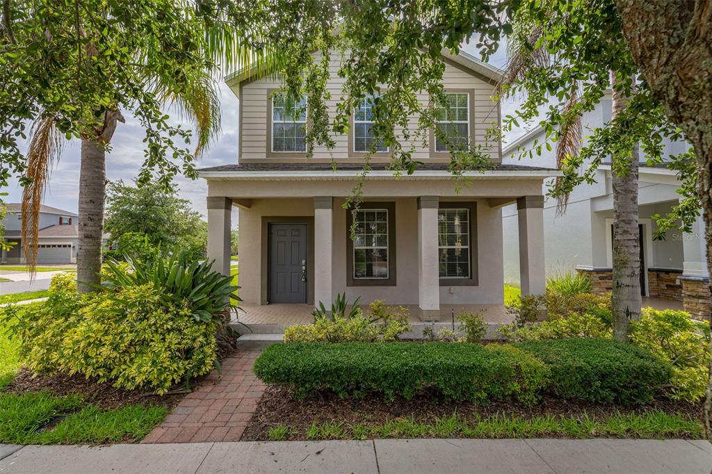 5911 Grassy Point Road Winter Garden, FL 34787 - Photo 1 of 1 front view of a house with a yard