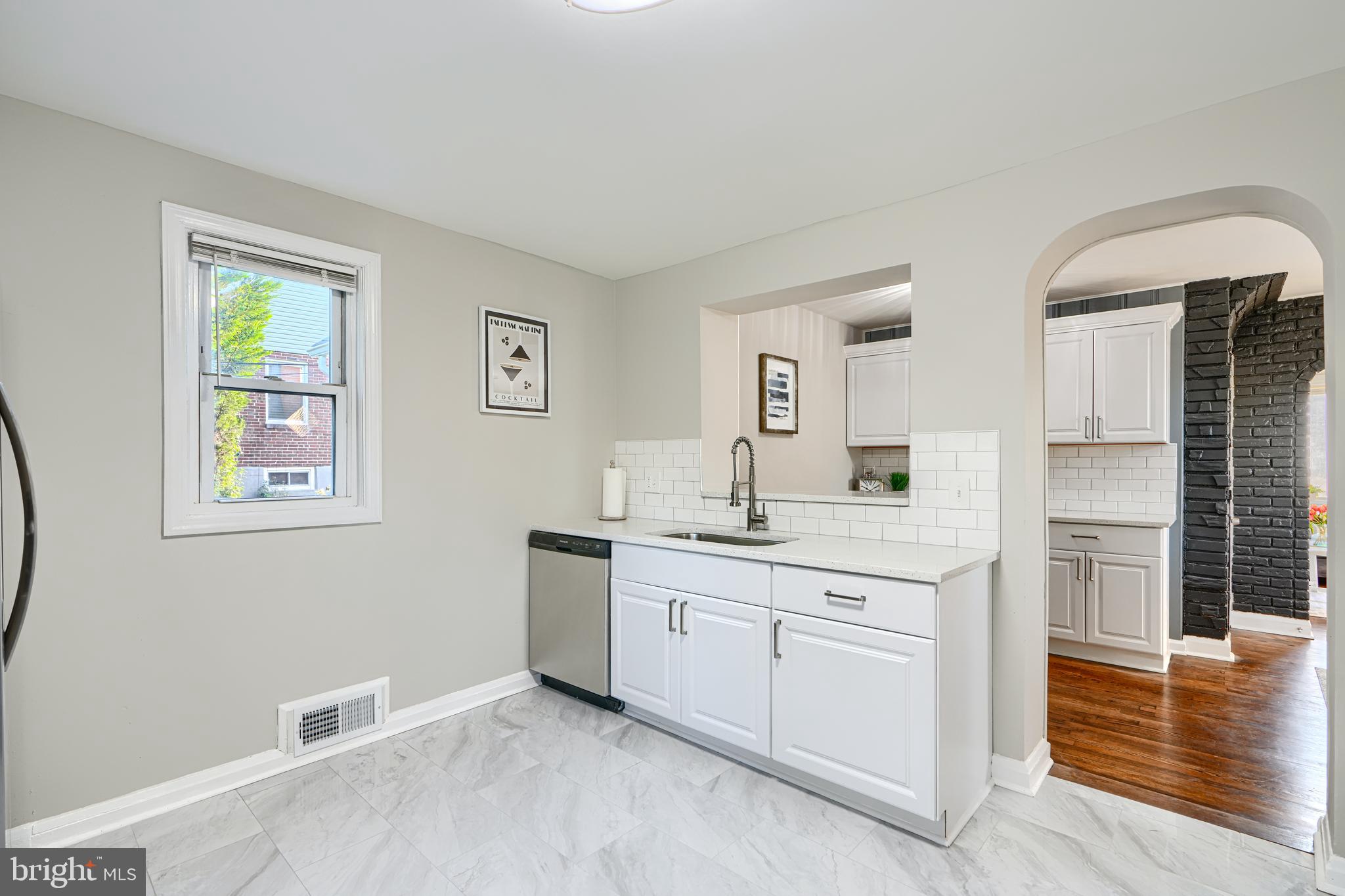 3515 Rhom Road Gwynn Oak, MD 21207 - Photo 13 of 36 a spacious bathroom with a granite countertop sink and a mirror