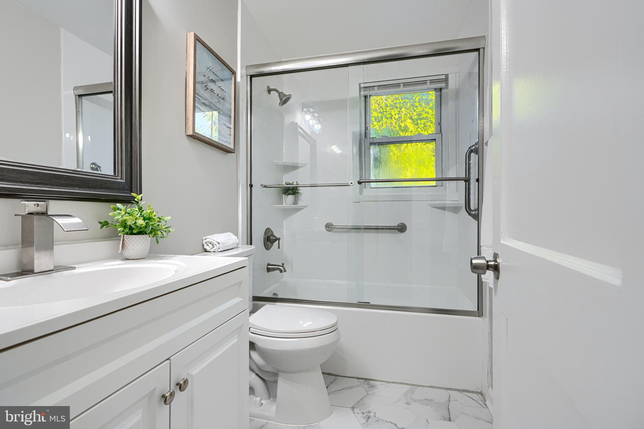 3515 Rhom Road Gwynn Oak, MD 21207 - Photo 16 of 36 a bathroom with a sink and a mirror