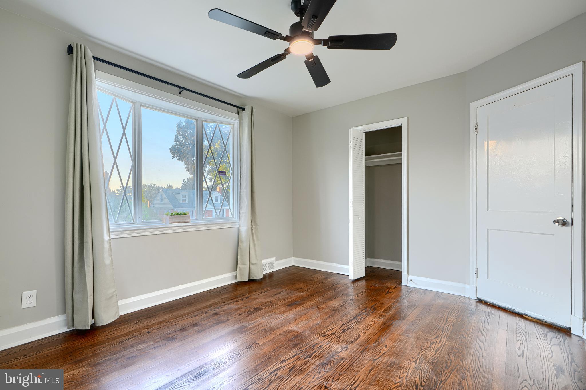 3515 Rhom Road Gwynn Oak, MD 21207 - Photo 17 of 36 a view of an empty room with wooden floor and a window