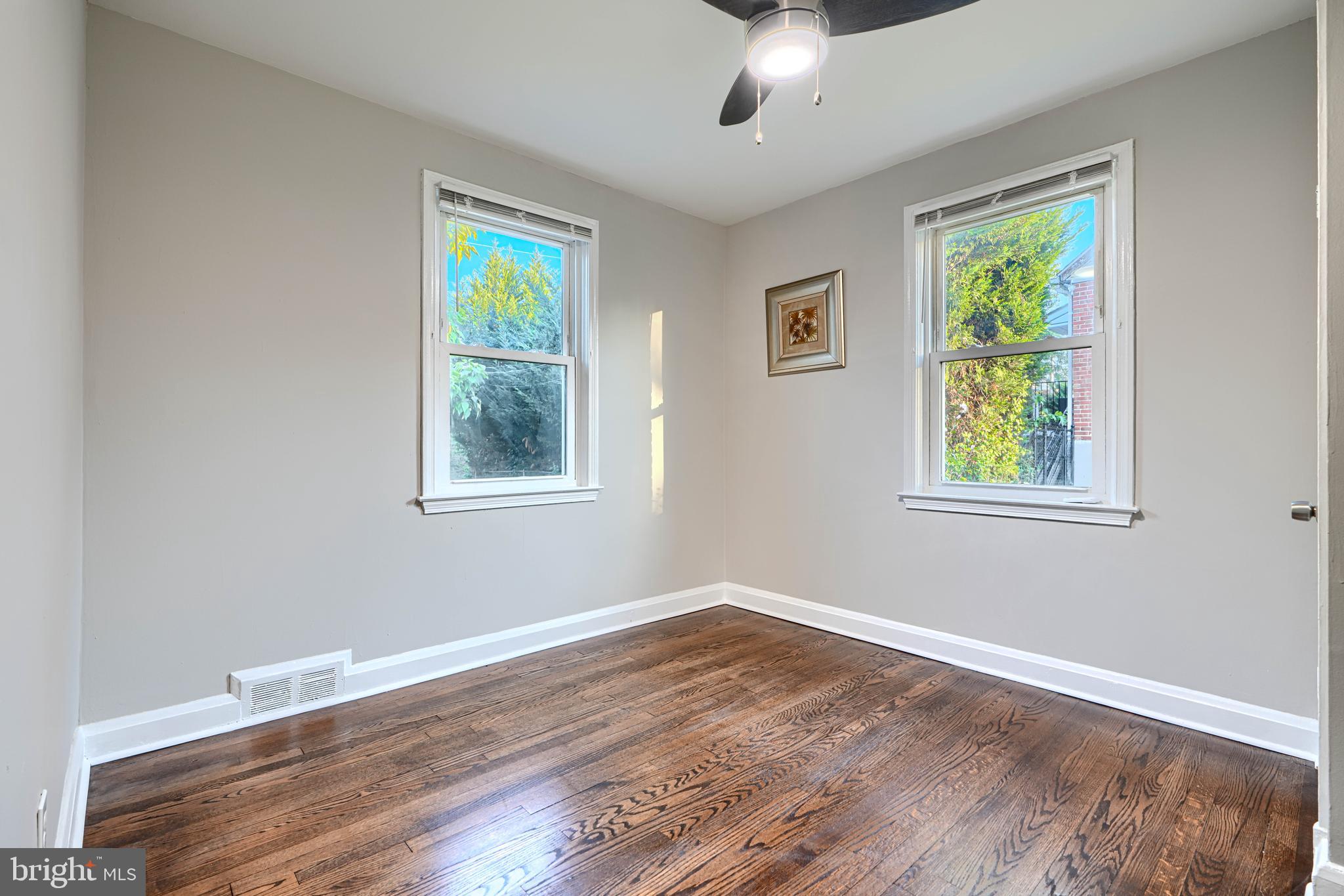 3515 Rhom Road Gwynn Oak, MD 21207 - Photo 18 of 36 a view of an empty room with wooden floor and a window