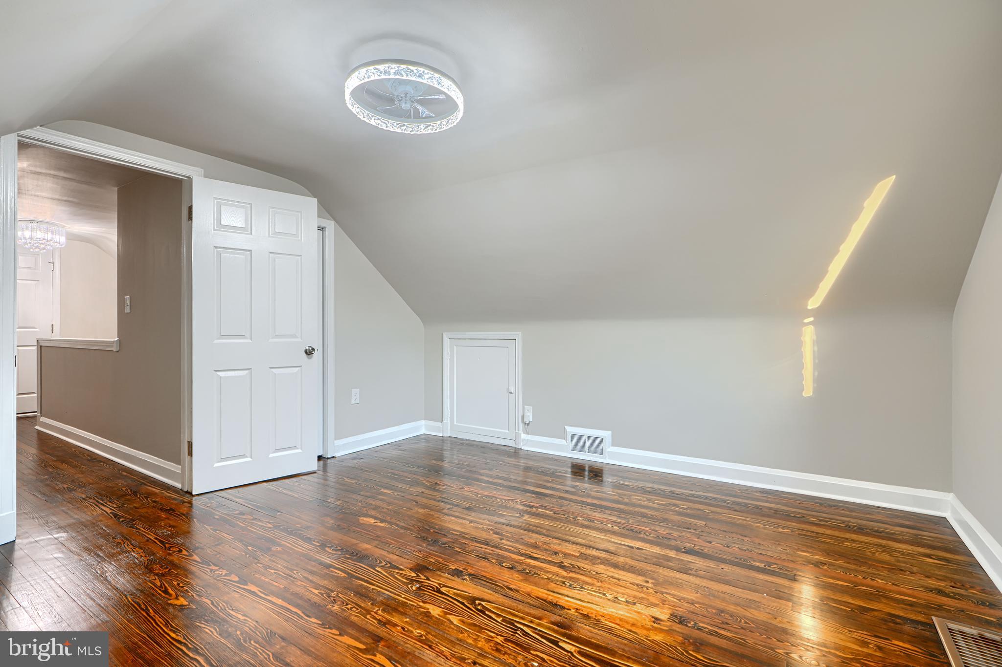 3515 Rhom Road Gwynn Oak, MD 21207 - Photo 22 of 36 a view of empty room with wooden floor