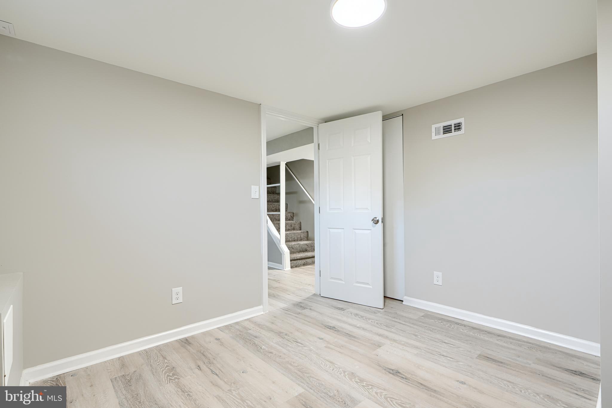 3515 Rhom Road Gwynn Oak, MD 21207 - Photo 28 of 36 a view of an empty room with wooden floor and closet