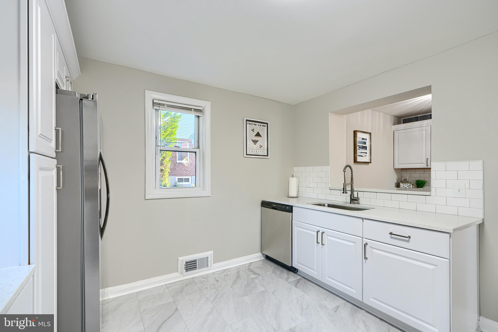 3515 Rhom Road Gwynn Oak, MD 21207 - Photo 10 of 36 a kitchen with a sink cabinets and stainless steel appliances