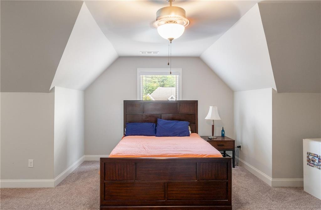 712 Fleeting Way Monroe, GA 30655 - Photo 22 of 29 a bedroom with a bed and a window