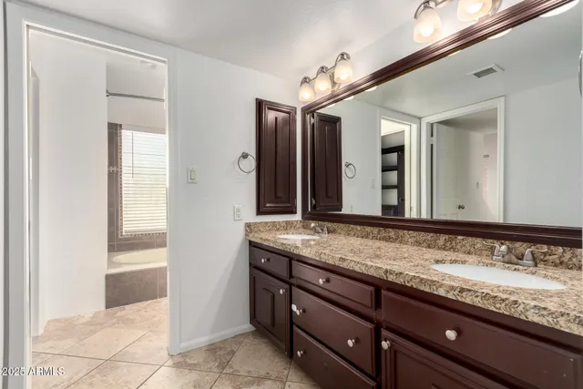 a bathroom with a bathtub and a toilet
