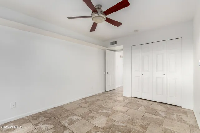 a bathroom with a bathtub sink vanity mirror and toilet