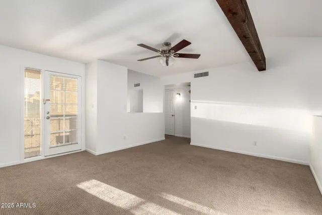 a view of a hallway with windows