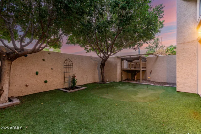 a backyard of a house with lots of green space