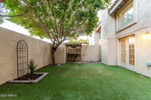 a view of a house with swimming pool and sitting area